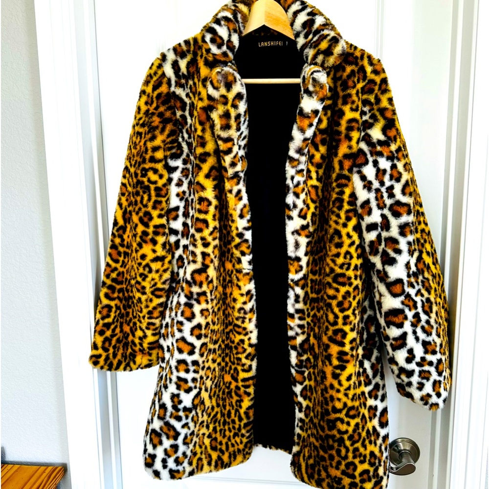 Fun animal print coat with hook and eye closure.
